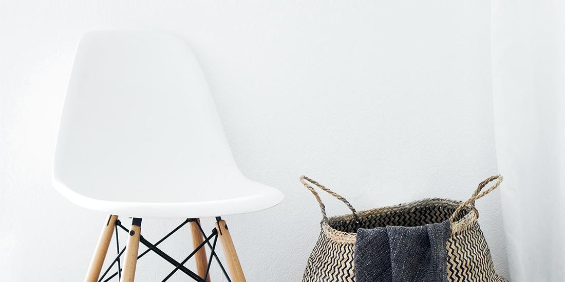 Chair and basket against a smooth wall